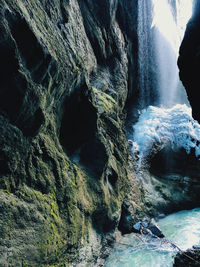 High angle view of water flowing through rocks