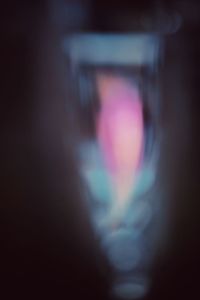 Defocused image of person on multi colored light