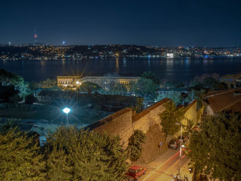 High angle view of illuminated city at night