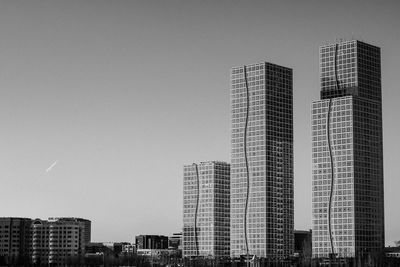 Low angle view of skyscrapers against clear sky