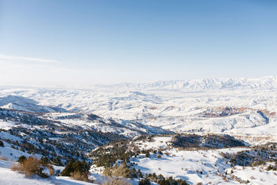 Crazy winter panorama of the tien shan mountains in uzbekistan in beldersay ski resort on a clear