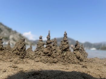 Close-up of rocks against clear sky