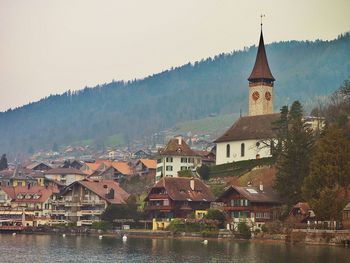 Buildings with mountain range in background