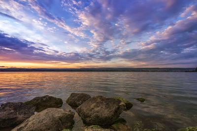 Scenic view of sea against sky during sunset