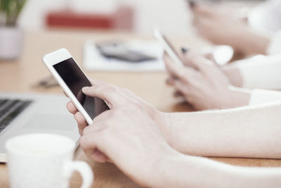 Close-up of woman using mobile phone