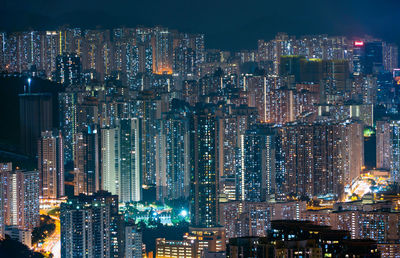 Aerial view of illuminated buildings in city at night