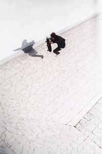 High angle view of man performing stunt on skateboard at park