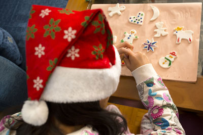 Close-up of girl making christmas decoration