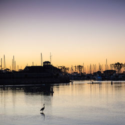 Silhouette of harbor at sunset