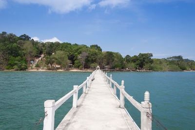 Pier over sea against sky