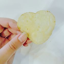 Close-up of hand holding ice cream