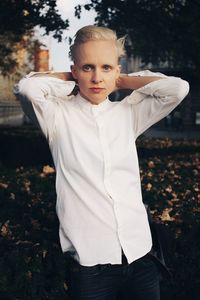 Portrait of teenage girl standing on field