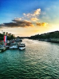 View of boats in sea at sunset