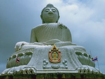 Low angle view of statue against sky