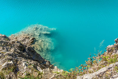 High angle view of sea against blue sky