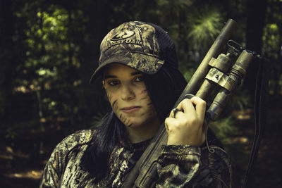 Portrait of young woman standing outdoors