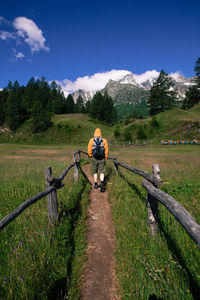 Rear view of man hiking at alpe devero