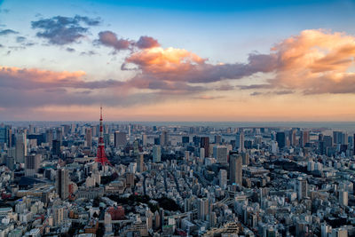 Aerial view of cityscape against sky during sunset