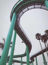 Low angle view of rollercoaster against sky