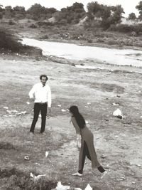 Full length of woman standing on beach