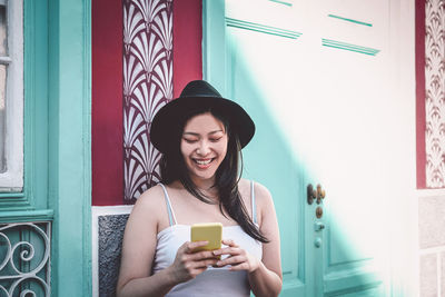 Young woman using mobile phone