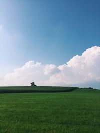 Countryside landscape against blue sky and clouds