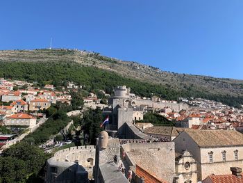 High angle view of townscape against clear blue sky