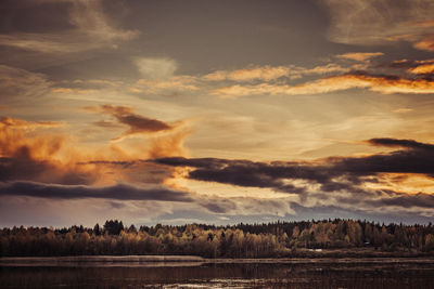 Scenic view of field against sky during sunset