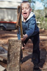Child chopping wood