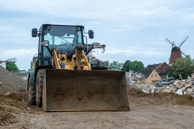 Construction site on field against sky