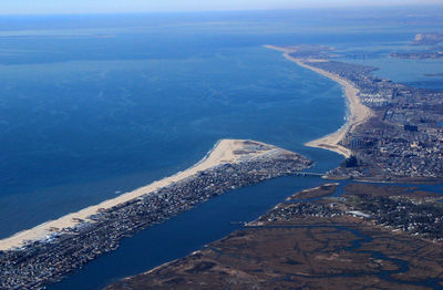 High angle view of sea against blue sky