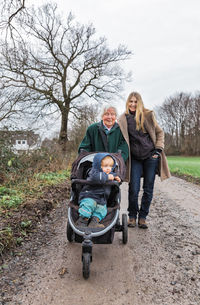 Female family on dirt road