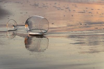 Close-up of wet glass on table