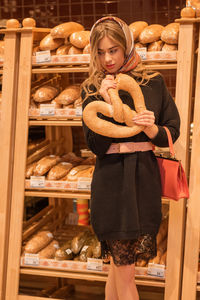 Rear view of woman standing in store