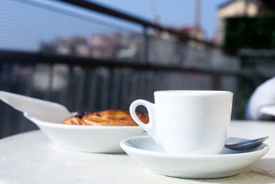 Close-up of coffee cup on table