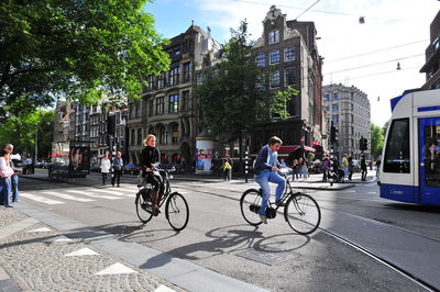 People riding bicycle on road