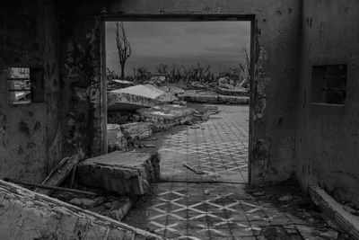 Abandoned building seen through window