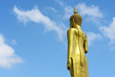 Low angle view of statue against blue sky