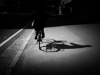 Person cycling on road