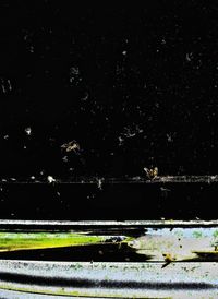 Close-up of sea against sky at night