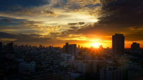High angle view of city at sunset