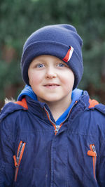 Portrait of boy standing outdoors