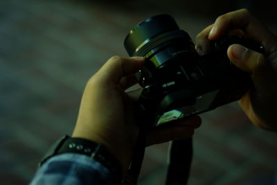 Midsection of person holding camera
