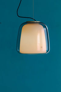 High angle view of a lamp against blue background