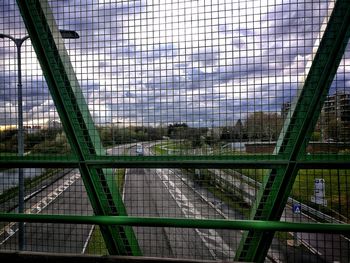 Metal grate on railroad bridge in city