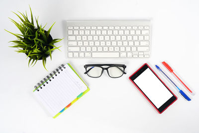 High angle view of laptop and text on table