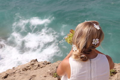 Rear view of woman looking at sea