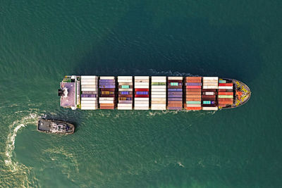 Aerial view container ship, logistic and transportation worldwide by container cargo ship boat.