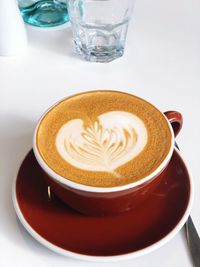 Close-up of cappuccino on table