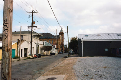 Street amidst buildings against sky